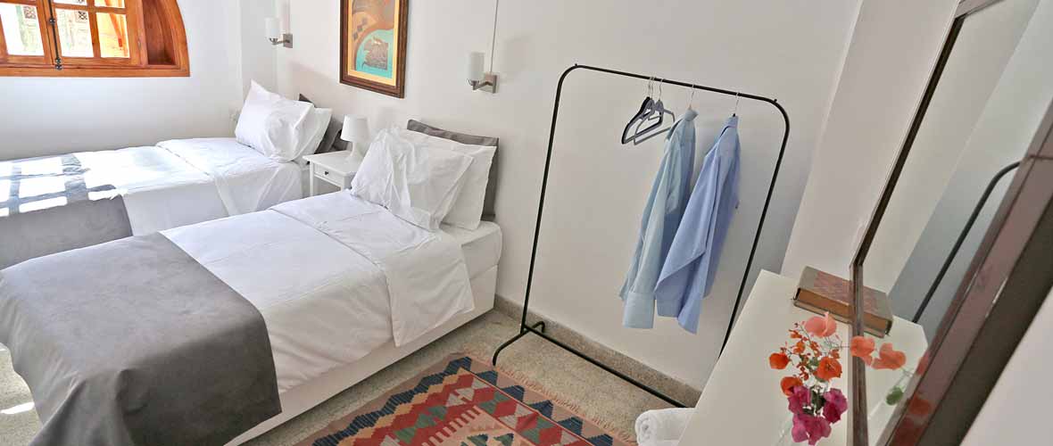 Bedroom with twin beds and Gothic window