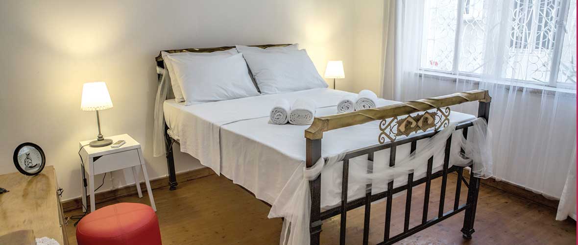 Double bed in airy bedroom. Linen provided.