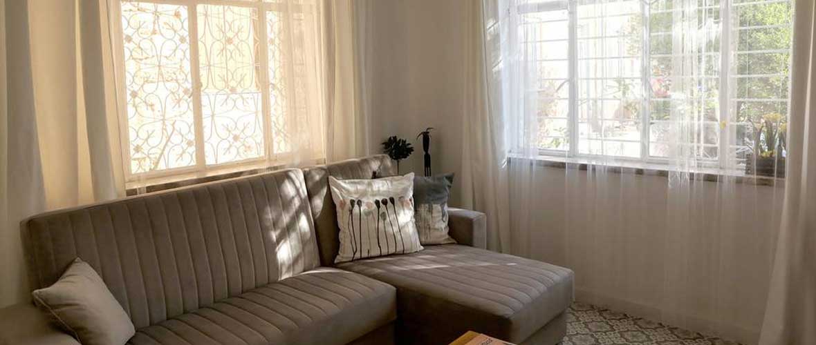 Light streaming in through the window of the comfortable living-room